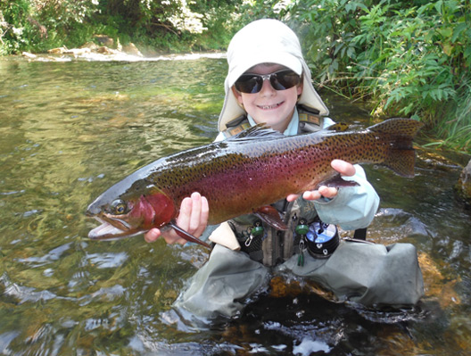 Tradd Little with a large rainbow trout.